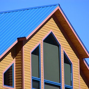 House with a blue standing seam metal roof