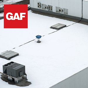 Top view of a flat, white commercial building roof with GAF logo on the top left