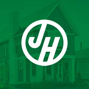 White James Hardie logo with only the J and H in a white circle on a green transparent background